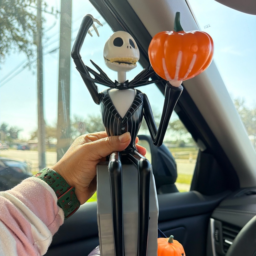 Black and White Skeleton Figure with Orange Pumpkin